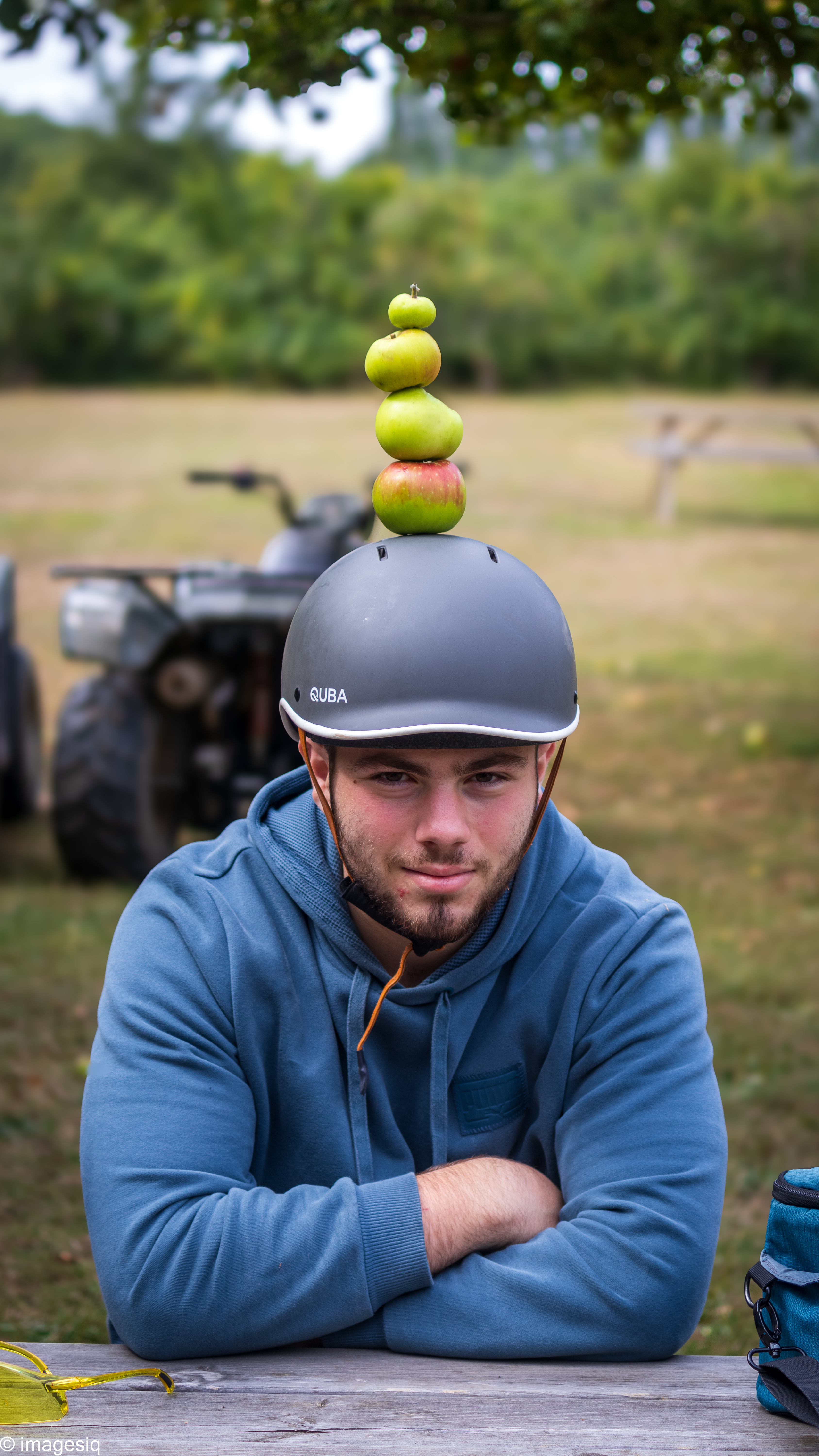 Boy with apples on helmet - Our community